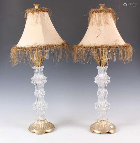 A pair of late 20th century glass table lamps with gilded fo...