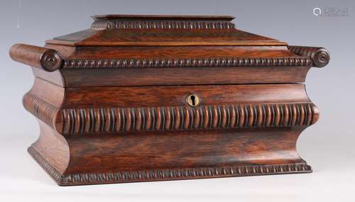 A Regency rosewood and brass inlaid box of shaped sarcophagu...