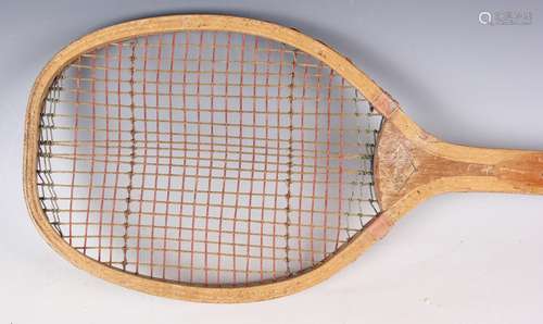 An early 20th century fishtail wooden tennis racquet, gilt t...