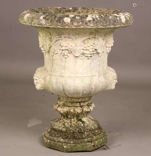 A 20th century cast composition stone garden urn of campana ...