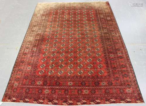 A fine Tekke style carpet, mid-20th century, the claret fiel...