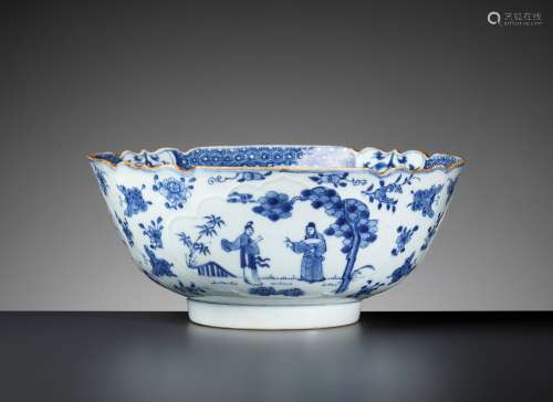 A BLUE AND WHITE PORCELAIN BOWL WITH FLOWERS AND BUTTERFLIES...