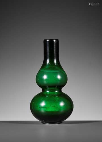 A TRANSLUCENT GREEN DOUBLE-GOURD GLASS VASE, GUANGXU MARK AN...