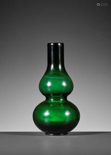 A TRANSLUCENT GREEN DOUBLE-GOURD GLASS VASE, GUANGXU MARK AN...