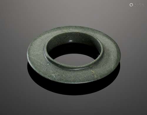 A COLLARED GREEN JADE DISC, SHANG DYNASTY