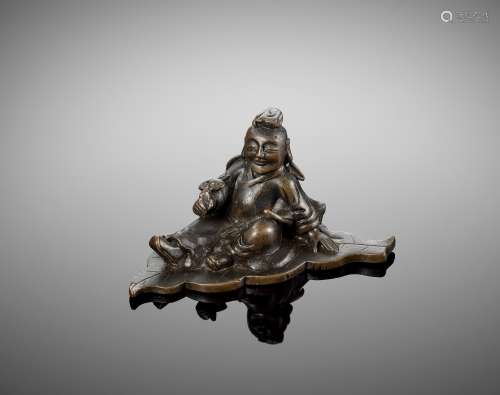 A FIGURAL BRONZE SCROLL WEIGHT, MING DYNASTY
