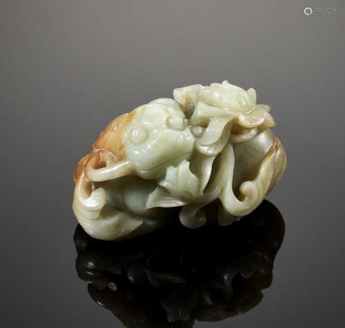 A CELADON AND RUSSET JADE BUDDHIST LION, LATE MING TO EARLY ...