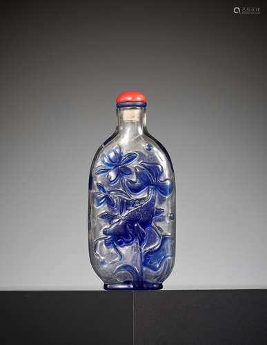 A SAPPHIRE-BLUE OVERLAY GLASS ‘CELESTIAL EYE’ SNUFF BOTTLE, ...