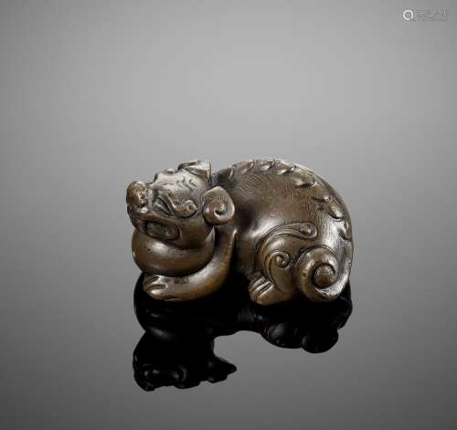 A HEAVY BRONZE ‘LION’ WEIGHT, MING DYNASTY
