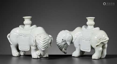 A DEHUA PAIR OF ELEPHANT CANDLE-HOLDERS, EARLY QING DYNASTY