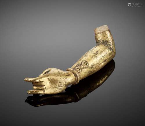 A GILT BRONZE ‘KARANA MUDRA’ FRAGMENTARY ARM, MING DYNASTY