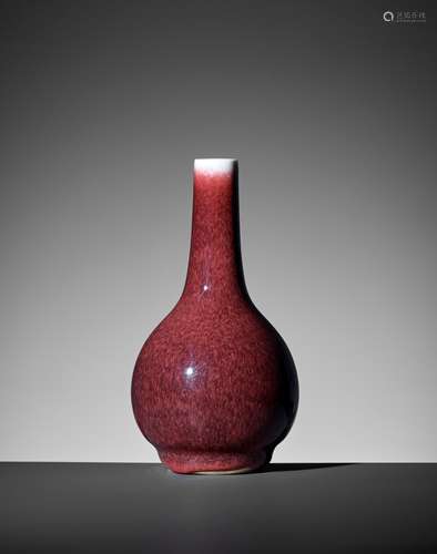 A SMALL COPPER-RED GLAZED BOTTLE VASE, QING DYNASTY