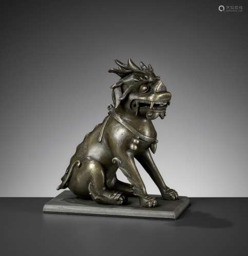 A SILVER WIRE-INLAID BRONZE FIGURE OF A QILIN, ATTRIBUTED TO...