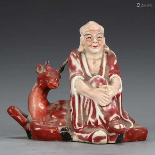 A Red Glazed Arhat with Deer