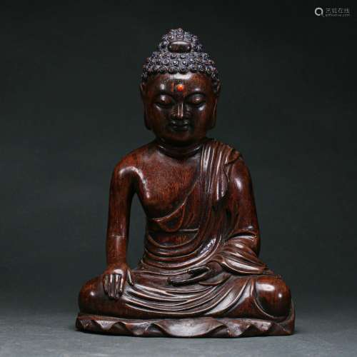 A Carved Aloes-wood Seated Buddha
