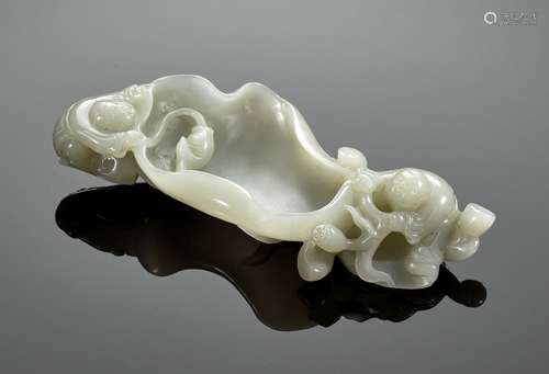 A CELADON JADE ‘BOYS’ WASHER, QING DYNASTY