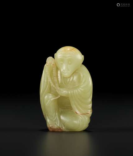 A YELLOW AND RUSSET JADE ZODIAC FIGURE OF A MONKEY, LATE QIN...