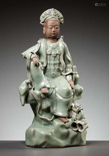 A LONGQUAN CELADON AND BISCUIT FIGURE OF GUANYIN, MING DYNAS...