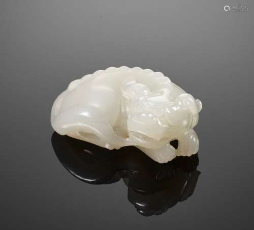 A WHITE JADE FIGURE OF A BUDDHIST LION, QING DYNASTY