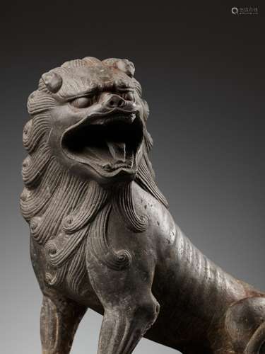 A SUPERBLY CARVED LIMESTONE FIGURE OF A LION, TANG DYNASTY