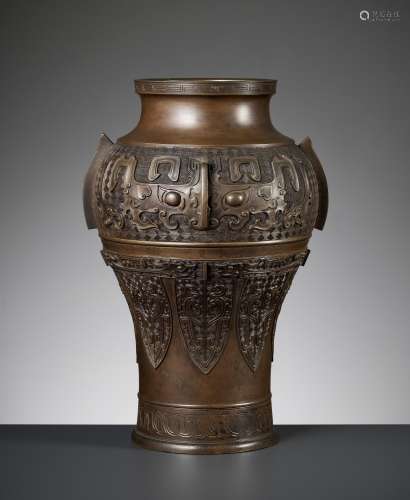 A MASSIVE BRONZE ‘ARCHAISTIC’ BALUSTER VASE, LATE MING TO EA...