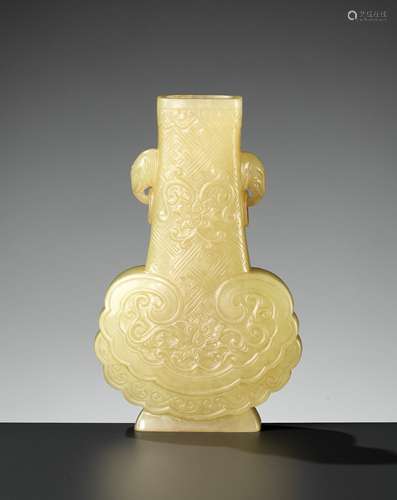 A RARE YELLOW JADE ‘RUYI’ VASE, QIANLONG MARK AND PERIOD