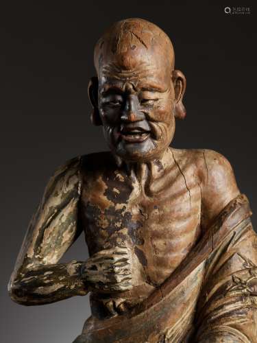 A PAINTED WOOD AND GESSO FIGURE OF A LUOHAN, MING DYNASTY
