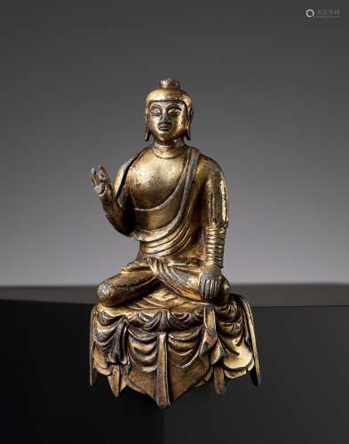 A MAGNIFICENT AND RARE GILT-BRONZE FIGURE OF BUDDHA, TANG DY...