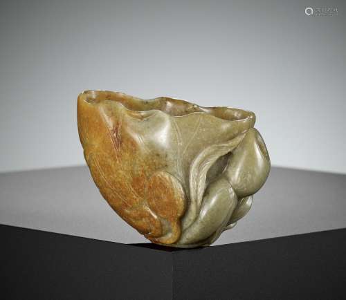 A CELADON AND RUSSET JADE ‘LOTUS LEAF’ BRUSH WASHER, 17TH CE...