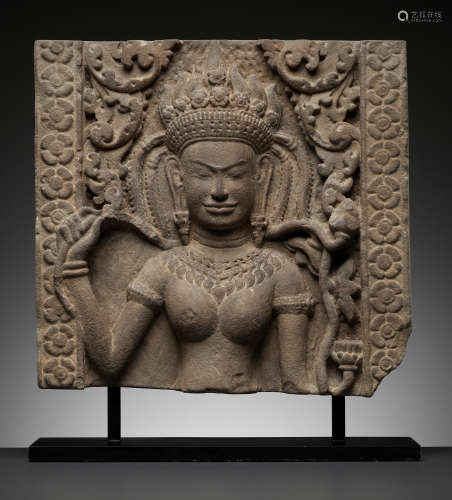 A SANDSTONE RELIEF OF AN APSARA, BAYON STYLE, ANGKOR PERIOD