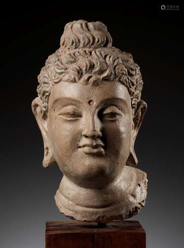 A RARE AND IMPORTANT TERRACOTTA HEAD OF BUDDHA SHAKYAMUNI