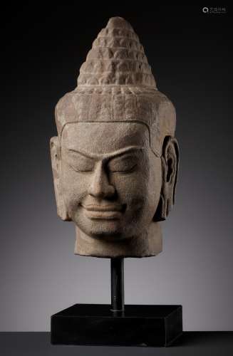 A SANDSTONE HEAD OF BUDDHA, BAYON STYLE, ANGKOR PERIOD