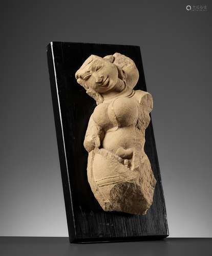 A SANDSTONE FIGURE OF A CELESTIAL WOMAN, SURASUNDARI