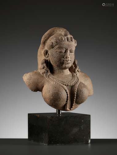 A PINK SANDSTONE BUST OF A CELESTIAL DEITY