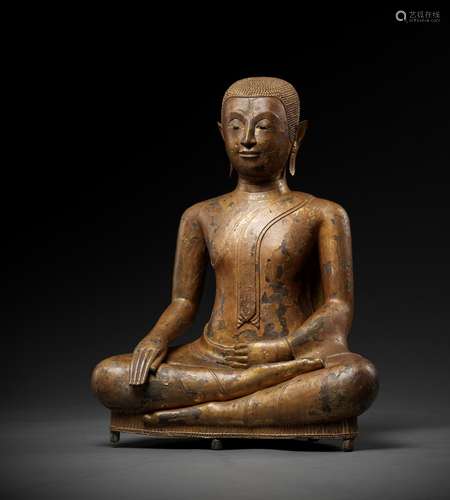 A RARE LACQUER-GILT BRONZE FIGURE OF AN ARHAT, AYUTTHAYA PER...