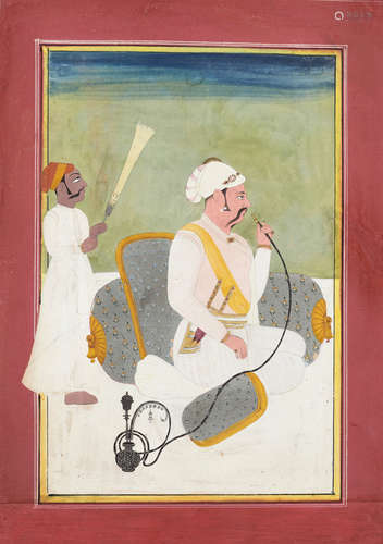 AN INDIAN MINIATURE PAINTING OF A MUGHAL PRINCE SMOKING A HU...