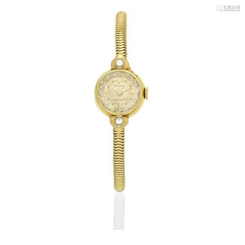 Rolex. A lady's 18K gold and diamond set manual wind coc...