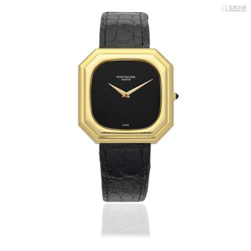 Patek Philippe. An 18K gold manual wind wristwatch with onyx...