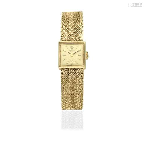 Rolex. A lady's 9K gold manual wind square form bracelet...