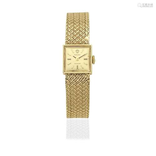 Rolex. A lady's 9K gold manual wind square form bracelet...