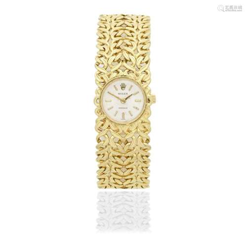 Rolex. A lady's 18K gold manual wind bracelet watch Prec...