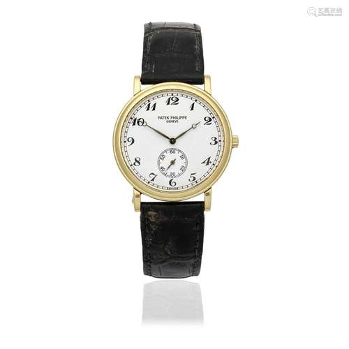 Patek Philippe. An 18K gold manual wind wristwatch Calatrava...