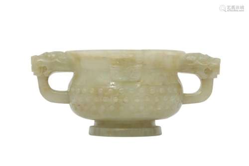 A CHINESE PALE CELADON JADE ARCHAISTIC CUP.