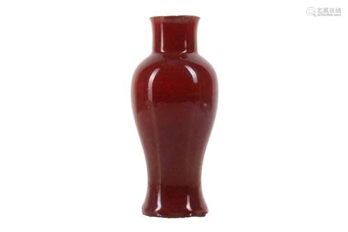 A CHINESE COPPER RED-GLAZED BALUSTER VASE.