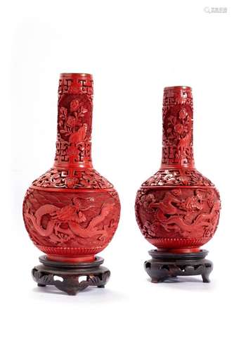 Pair of red lacquer vases carved and engraved with dragons a...