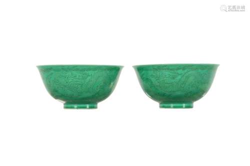 A PAIR OF CHINESE INCISED GREEN-GLAZED 'DRAGON' BOWL...