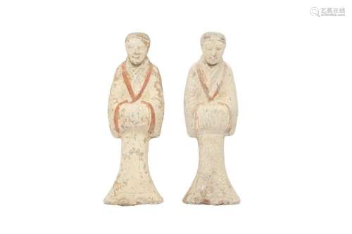 A NEAR-PAIR OF CHINESE POTTERY FIGURES OF ATTENDANTS.