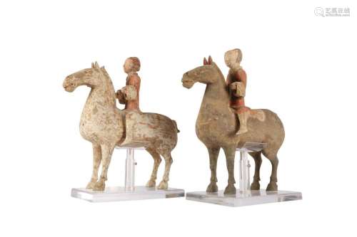 TWO CHINESE POTTERY HORSES AND RIDERS.