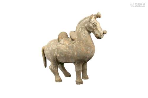 A CHINESE POTTERY MODEL OF A SADDLED HORSE