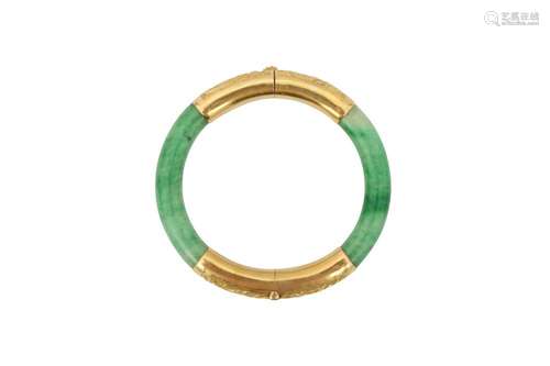 A CHINESE APPLE-GREEN JADEITE BANGLE.